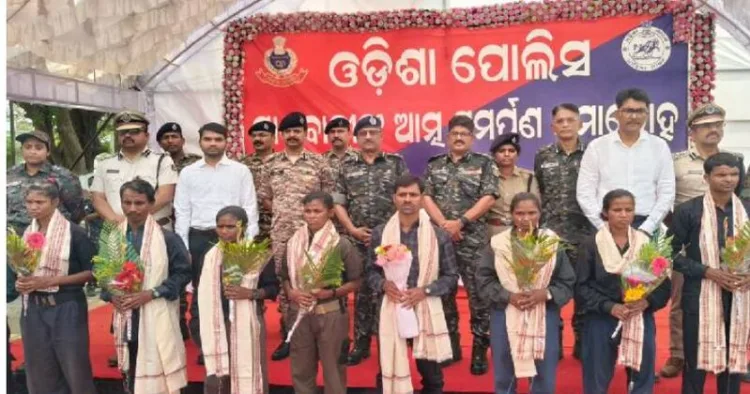Maoist cadres lay down their arms before Odisha DGP Yogesh Bahadur Khurania in the presence of senior police and paramilitary officers during a surrender programme