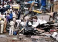 Police at the scene of one of the blasts. Pic/AFP