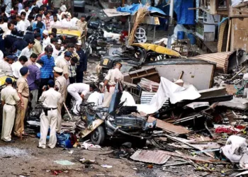 Police at the scene of one of the blasts. Pic/AFP