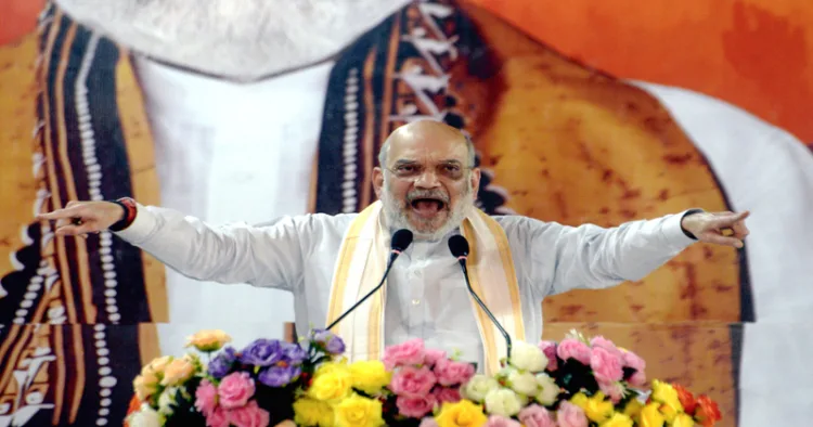 South 24 Parganas, Mar 02 (ANI): Union Home Minister Amit Shah addresses during the Parivartan Yatra in Mathurapur, in South 24 Parganas on Monday. (ANI Photo)
