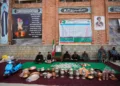 Volunteers wait at a collection point during a donation drive for Iran in Budgam, Indian-controlled Kashmir, Monday, March 23, 2026