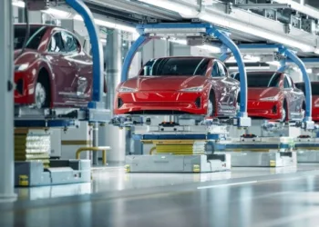 Electric vehicles being manufactured in a factory