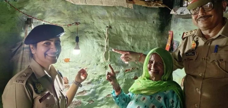 A representative image of an IPS officer bringing light to the house of an elderly woman