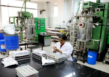 A woman working in a lab where medicines are being manufactured