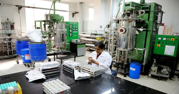 A woman working in a lab where medicines are being manufactured