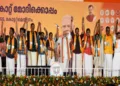 PM Narendra Modi on the stage with others during a rally in Keralam