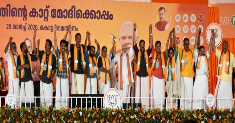 PM Narendra Modi on the stage with others during a rally in Keralam