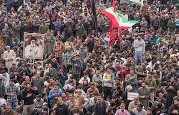 People gather during a protest against the killing of Iran's late Supreme Leader Ayatollah Ali Khamenei
