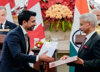 PM Modi and PM Mark Carney witness an MoU exchange between EAM S Jaishankar and Canada's Minister of International Trade Maninder Sidhu during a joint press meet, at Hyderabad House in New Delhi, Monday, March 2, 2026