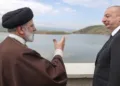 Then- Iranian President Ebrahim Raisi speaks with Azerbaijani President Ilham Aliyev on the day of the helicopter crash that killed Raisi, at the border of Iran and Azerbaijan, May 19, 2024