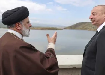 Then- Iranian President Ebrahim Raisi speaks with Azerbaijani President Ilham Aliyev on the day of the helicopter crash that killed Raisi, at the border of Iran and Azerbaijan, May 19, 2024