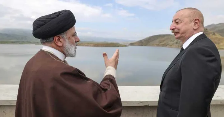 Then- Iranian President Ebrahim Raisi speaks with Azerbaijani President Ilham Aliyev on the day of the helicopter crash that killed Raisi, at the border of Iran and Azerbaijan, May 19, 2024