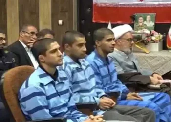 Iran's state media released footage on Thursday of the three men at their trial