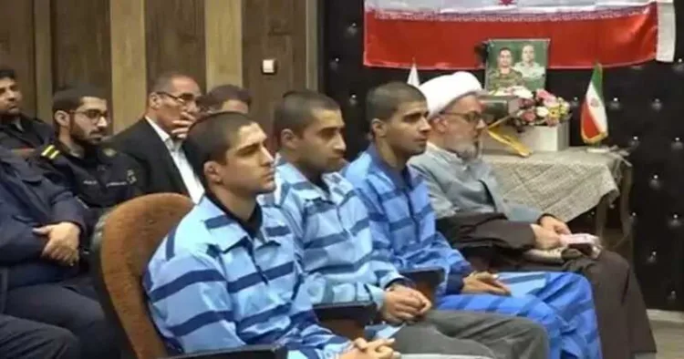 Iran's state media released footage on Thursday of the three men at their trial