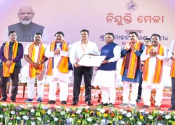 Chief Minister Mohan Charan Majhi along with other dignitaries at the 15th Recruitment Fair held at Kalinga Stadium