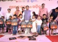 CM Mohan Majhi with young children during the State-Level Khadi Chuan (Initiation into Learning) Ceremony at Raj Bhavan Upper Primary School in Bhubaneswar.