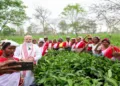 Dibrugarh [Assam], Apr 01 (ANI): Prime Minister Narendra Modi and women workers pose for a group selfie during his visit to a tea estate in Dibrugarh on Wednesday. (@narendramodi/ANI Photo)