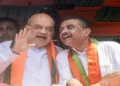 Kolkata, Apr 02 (ANI): Union Home Minister Amit Shah and West Bengal Assembly LoP and BJP candidate Suvendu Adhikari during the mega nomination rally for the Bhabanipur Assembly constituency, in Kolkata on Thursday. (ANI Photo)