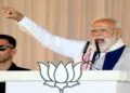Barpeta, Apr 06 (ANI): Prime Minister Narendra Modi speaks during a public event, in Barpeta on Monday. (ANI Photo)