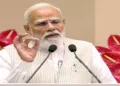 New Delhi, Apr 13 (ANI): Prime Minister Narendra Modi addresses during the national level 'Nari Shakti Vandan Sammelan', in New Delhi on Monday. (DD/ANI Video Grab)