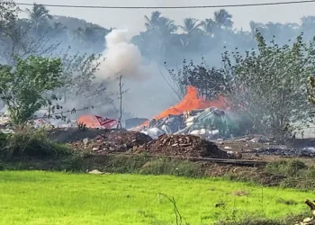 Thrissur [Keralam], Apr 21 (ANI): Dark smoke and flames billow out from the fireworks storage facility fire at Mundathikode, in Thrissur on Tuesday. Eight people lost thier live in the incident so far. (ANI Video Grab)