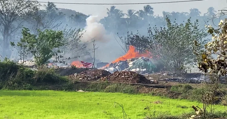 Thrissur [Keralam], Apr 21 (ANI): Dark smoke and flames billow out from the fireworks storage facility fire at Mundathikode, in Thrissur on Tuesday. Eight people lost thier live in the incident so far. (ANI Video Grab)