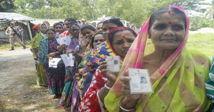 Purba Medinipur [West Bengal], Apr 23 (ANI): Voters show their voting cards while waiting in line to cast their votes during the first phase of the West Bengal Assembly elections 2026 at a polling station, in Purba Medinipur on Thursday. (ANI Photo used for representative purposes)