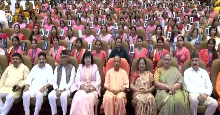 UP CM Yogi Adityanath distributed smartphones to Anganwadi workers and helpers