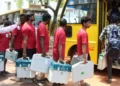 Polling officials at Mothilal Nehru Polytechnic College in Puducherry carry ballot boxes to be sent to various polling booths across the Union Territory