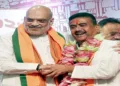 Kolkata, May 08 (ANI): Union Home Minister Amit Shah congratulates BJP leader Suvendu Adhikari after he is elected as the leader of the West Bengal BJP Legislative Party and set to be the new CM of the state, in Kolkata on Friday. (ANI Video Grab)