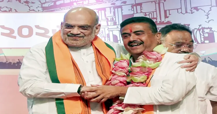 Kolkata, May 08 (ANI): Union Home Minister Amit Shah congratulates BJP leader Suvendu Adhikari after he is elected as the leader of the West Bengal BJP Legislative Party and set to be the new CM of the state, in Kolkata on Friday. (ANI Video Grab)