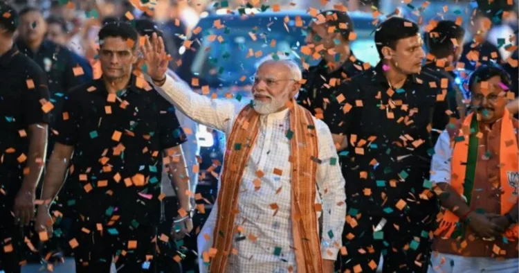 PM Narendra Modi waving at the crowd