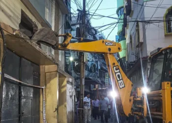 A bulldozer in action at Tiljala in Kolkata.