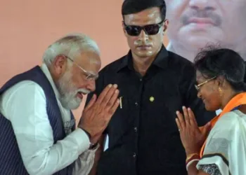 Prime Minister Narendra Modi and BJP candidate from Panihati Assembly constituency Ratna Debnath greet each other during the campaign for her ahead of the second phase of the West Bengal assembly elections