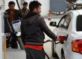 A man filling petrol in the car