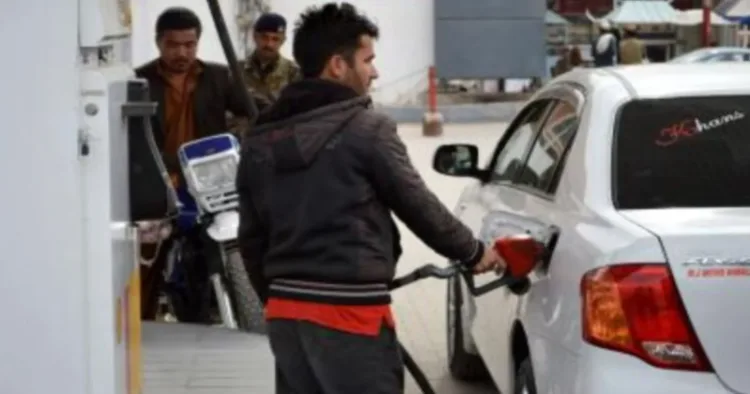 A man filling petrol in the car