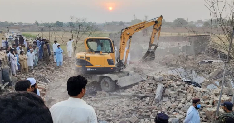 Locals gather at the site of the blast in Bannu district of Khyber Pakhtunkhwa