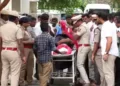 Body of the girl who was brutally assaulted and murdered in Sulur on a stretcher surrounded by policemen
