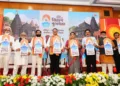 Chief Minister Devendra Fadnavis, Deputy CM Eknath Shinde and Deputy CM Sunetra Ajit Pawar.along with other dignitaries on the stage at the unveiling of Nashik Kumbh's logo