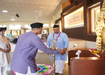 RSS Sah-Sarkaryavah Atul Limaye lighting the ceremonial lamp on the first day of Karyakarta Vikas Varg-Dwitiya at the Maharshi Vyas Sabhagruha, located in the Dr. Hedgewar Smruti Bhavan premises in Reshimbag, Nagpur.