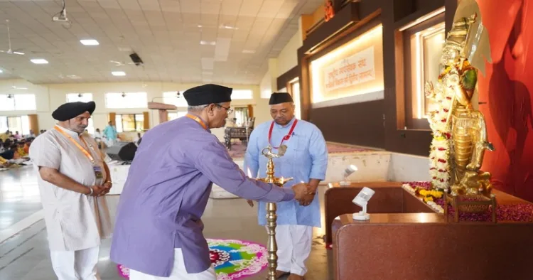 RSS Sah-Sarkaryavah Atul Limaye lighting the ceremonial lamp on the first day of Karyakarta Vikas Varg-Dwitiya at the Maharshi Vyas Sabhagruha, located in the Dr. Hedgewar Smruti Bhavan premises in Reshimbag, Nagpur.