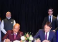 Tata Electronics CEO Randhir Thakur and ASML CEO Christophe Fouquet sign a MoU as PM Modi and Dutch PM Rob Jetten look on, during a two-day visit to the Netherlands in May 16, 2026