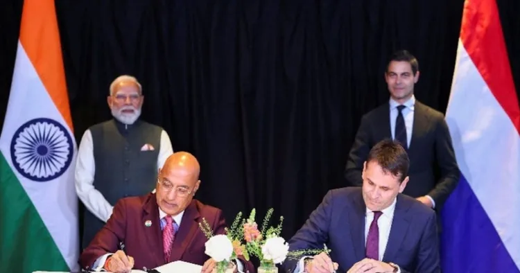 Tata Electronics CEO Randhir Thakur and ASML CEO Christophe Fouquet sign a MoU as PM Modi and Dutch PM Rob Jetten look on, during a two-day visit to the Netherlands in May 16, 2026