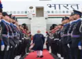 Prime Minister Narendra Modi walks past a ceremonial guard of honour after arriving in Rome for the final leg of his five-nation diplomatic tour