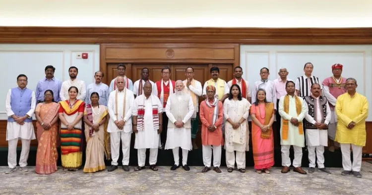 Prime Minister Narendra Modi with representatives of the Janjati Suraksha
Manch