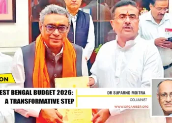 West Bengal Chief Minister Suvendu Adhikari (R) and State Finance Minister Swapan Dasgupta (L) display copies of the State Budget after its presentation in the West Bengal Legislative Assembly, in Kolkata