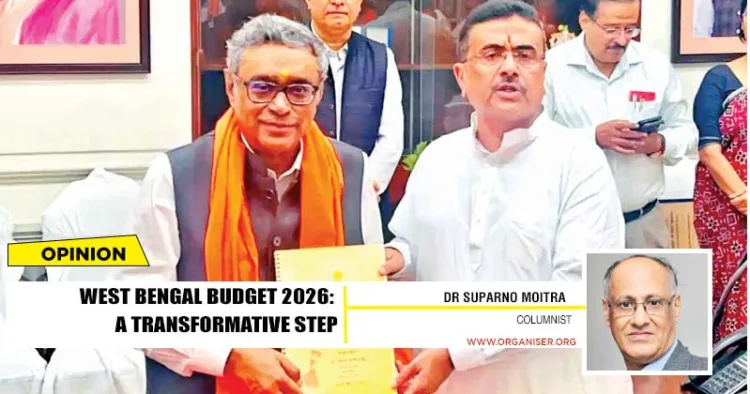 West Bengal Chief Minister Suvendu Adhikari (R) and State Finance Minister Swapan Dasgupta (L) display copies of the State Budget after its presentation in the West Bengal Legislative Assembly, in Kolkata