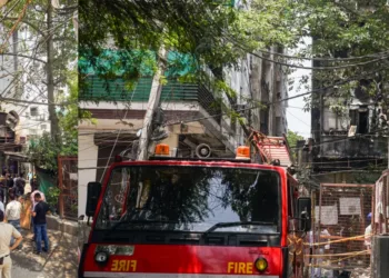 Fire-fighting officials at the site of the restaurant in Delhi Malviya Nagar