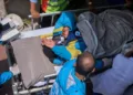 Everest Survivor being taken to the hospital on a stretcher