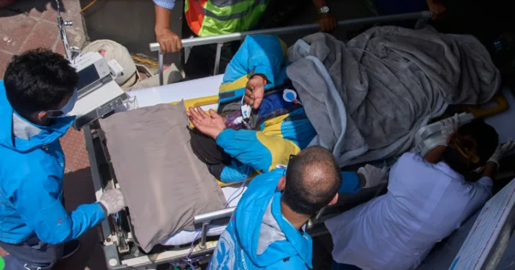 Everest Survivor being taken to the hospital on a stretcher